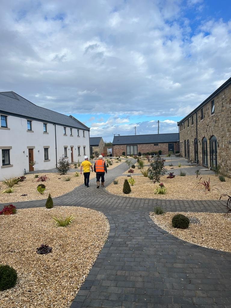 image of william jackson walkking around the northumberland living development "West Chevington Farm"